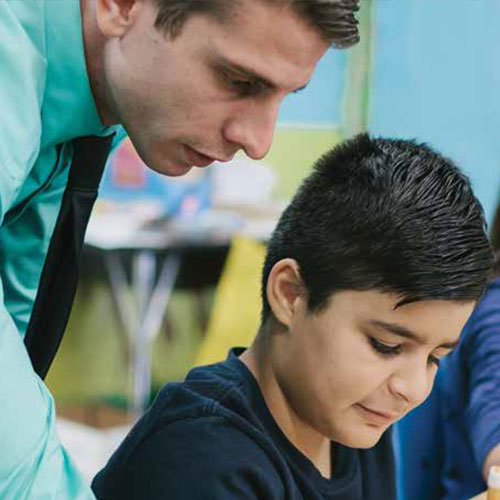 Teacher helping a student